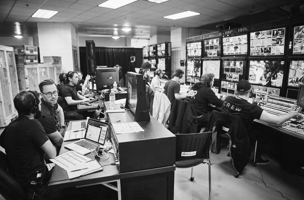 A production team working in a live control room.