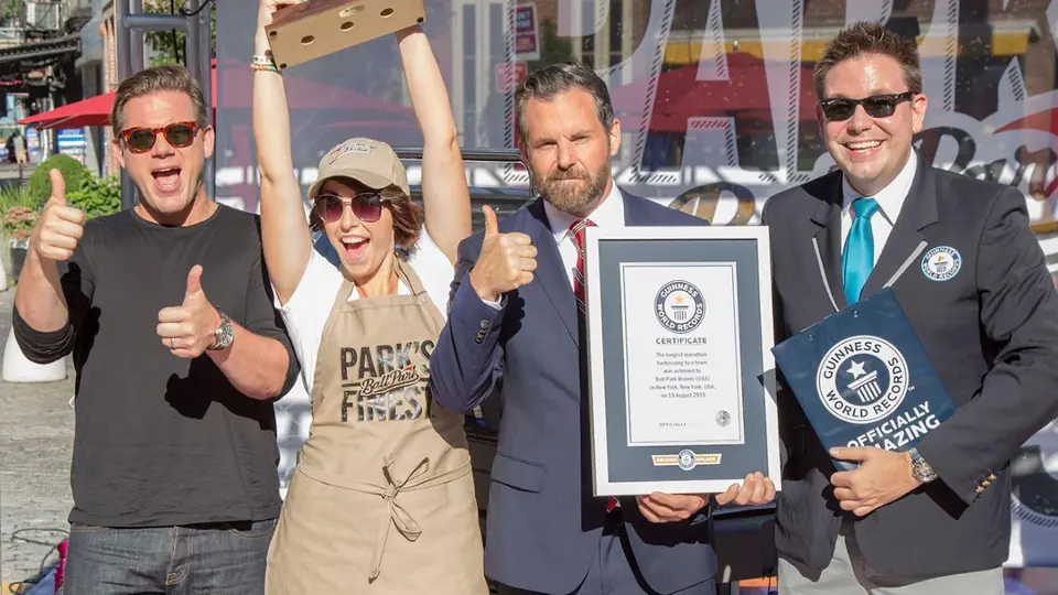 The team holding the Guinness World Records certificate.