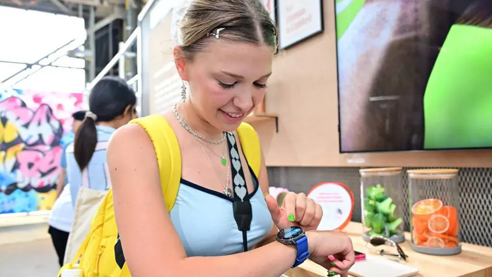 An attendee trying a smartwatch.