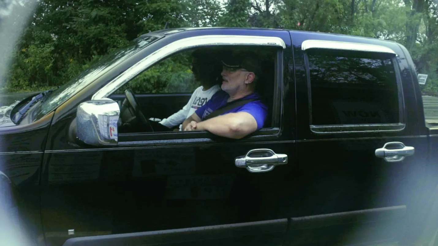 A driver in a pickup at the drive-thru window.