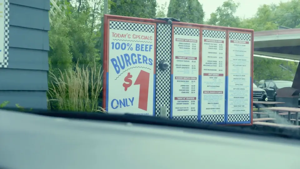 A drive-thru menu board advertising one dollar burgers.
